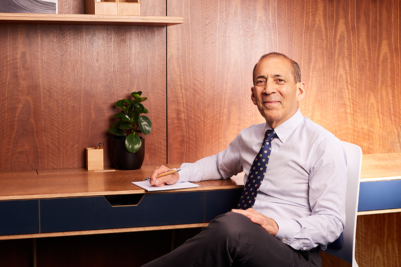 Dr Bayardo Martell Endodontist at desk