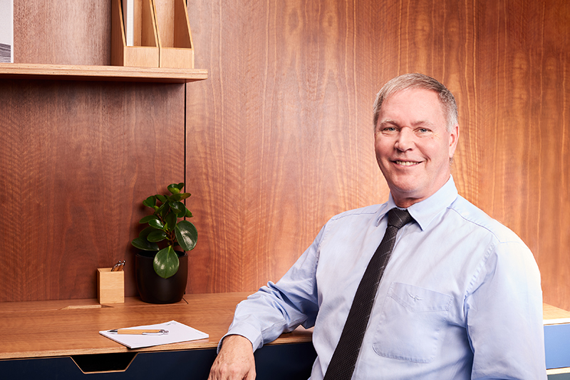 Dr John M<sup>c</sup>Namara Endodontist at desk