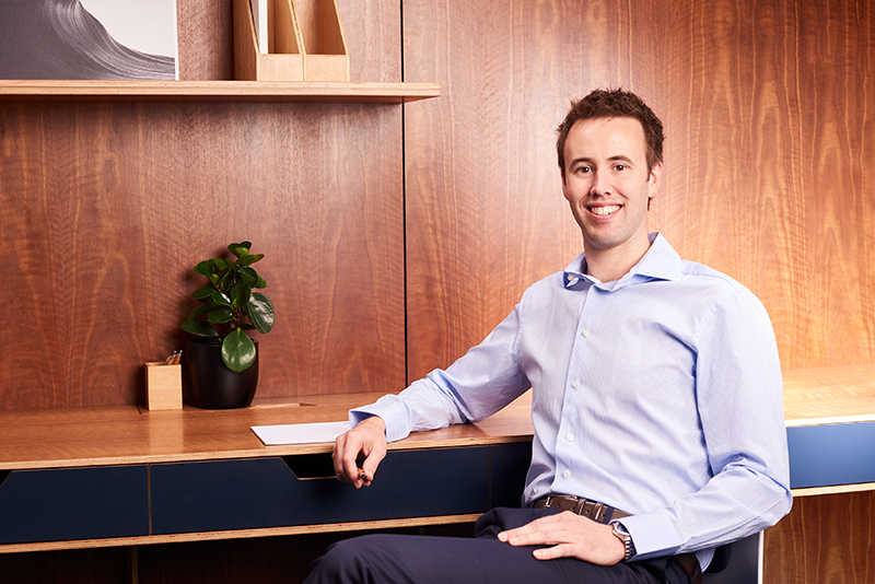 Dr Jonathan Moore Endodontist at desk